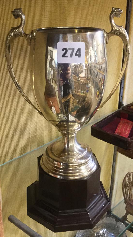 A large two handled silver trophy cup, on stand